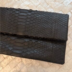 Leather clutch with snake detailing